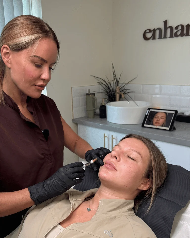 Aesthetics practitioner performing facial dermal filler and injectable treatment at Enhance Me Aesthetics in Essex